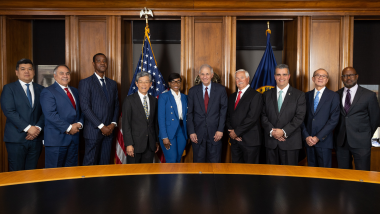 MDI Subcommittee posing in boardroom with Chairman Gruenberg